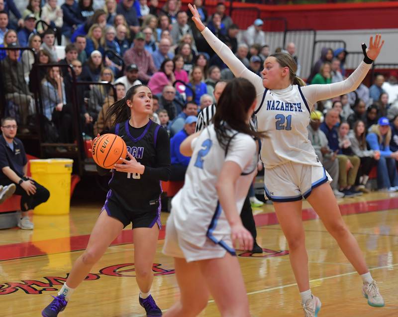 Downers Grove North’s Campbell Thulin looks to pass as she is defended by Nazareth’s Lyla Shelton (21) and Samantha Austin (2) during the Class 4A Hinsdale Central Sectional final game on February 26, 2026 at Hinsdale Central High School in Hinsdale.