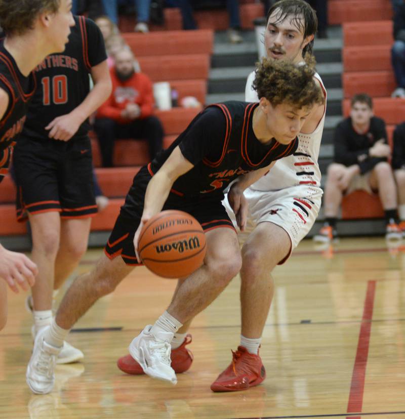 Erie-Prophetstown's Jeremiah Kochevar heads up court during Saturday, Dec. 30, 2023 action against Forreston at the Warkins Memorial Tournament held at Erie High School.