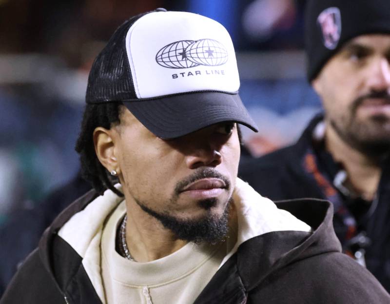 Musician Chance The Rapper stands on the sidelines before the Chicago Bears play the Green Bay Packers in the NFL Wild Card game Saturday, Jan. 10, 2026, at Soldier Field in Chicago.