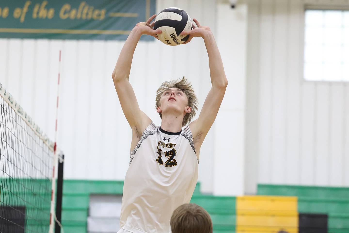 Joliet West’s Landon Brouwer sets the ball against Providence on Tuesday, April 16, 2024 in New Lenox.