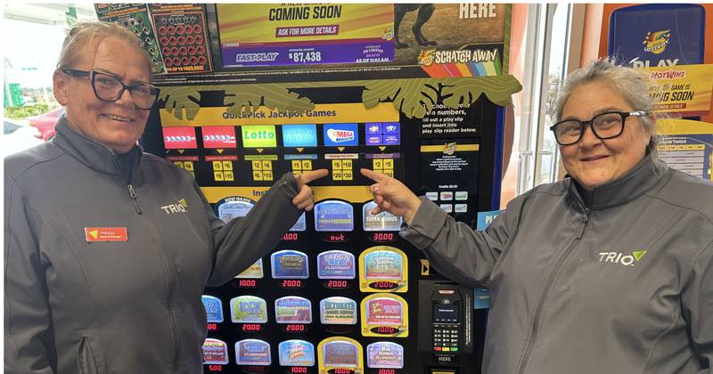 Melissa Motroni, left, store manager at Bull Valley Trio in McHenry, celebrates
with district manager Stephanie Walters after the store sold a $3 million winning Mega Millions ticket for the drawing on Tuesday, Oct. 21, 2025.