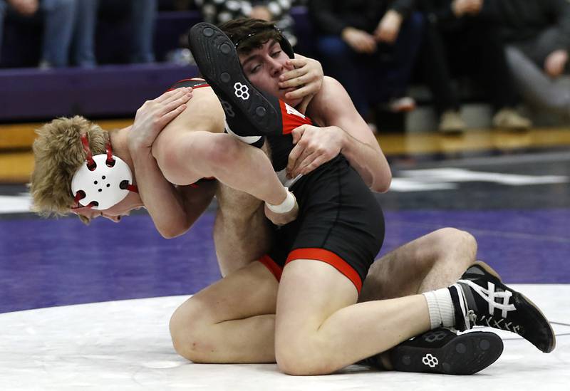 Huntley's Radic Dvorak tries to get away from Hampshire's Mike Brannigan during the 157-pound match of a Fox Valley Conference wrestling meet on Wednesday, Jan. 8, 2025, at Hampshire High School.