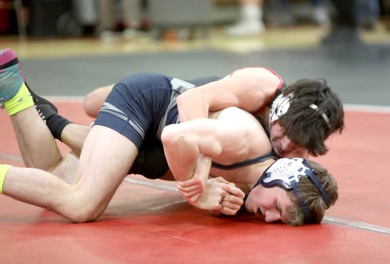 Yorkville’s Dominic Recchia (top) faces Oswego East’s Braedan Grisham in the 138-pound weight class during a dual meet on Thursday, Jan. 9, 2025 in Yorkville.