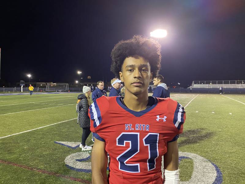 St. Rita's Zack Clark had two interceptions to help the Mustangs defeat Geneva 27-14 in the Class 7A playoff opener on Friday.