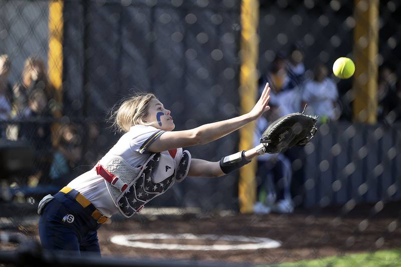 Sterling’s Marley Sechrest reaches but comes up short on a pop up against Morrison Wednesday, April 26, 2023.