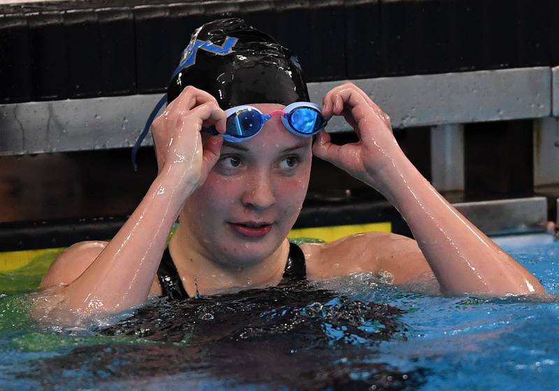 St. Charles North’s Kate Farrell checks her time of 2:01.29 in the 200-yard individual medley during the girls state swimming preliminaries at the FMC Natatorium on Friday, Nov. 14, 2025 in Westmont.