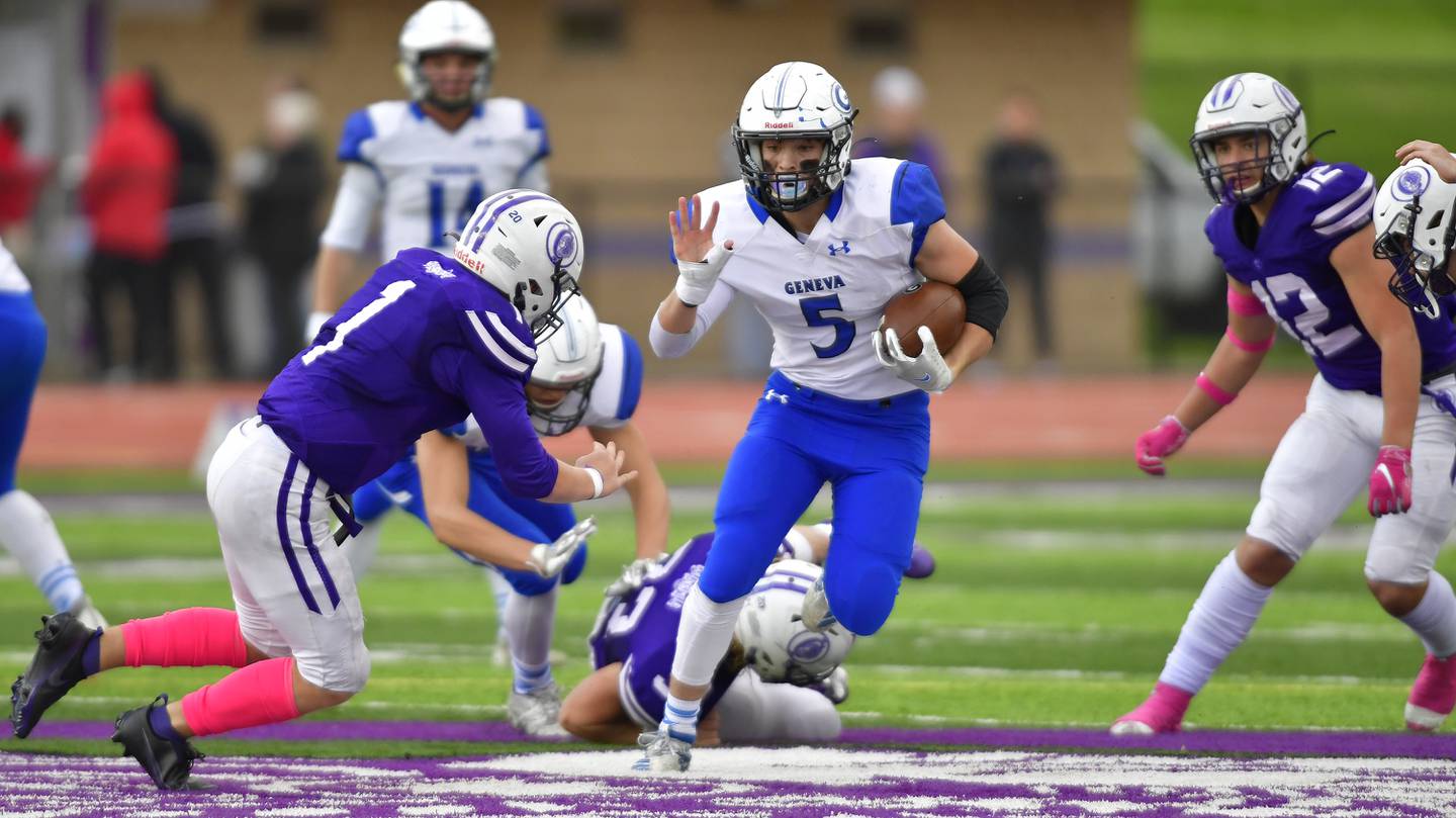 Geneva running back Carter Powelson (center) moves through a gap in the Collinsville defense. Geneva defeated Collinsville 28-2 in a Class 7A first-round football playoff game at Collinsville High School in Collinsville, IL on Saturday October 30, 2021.