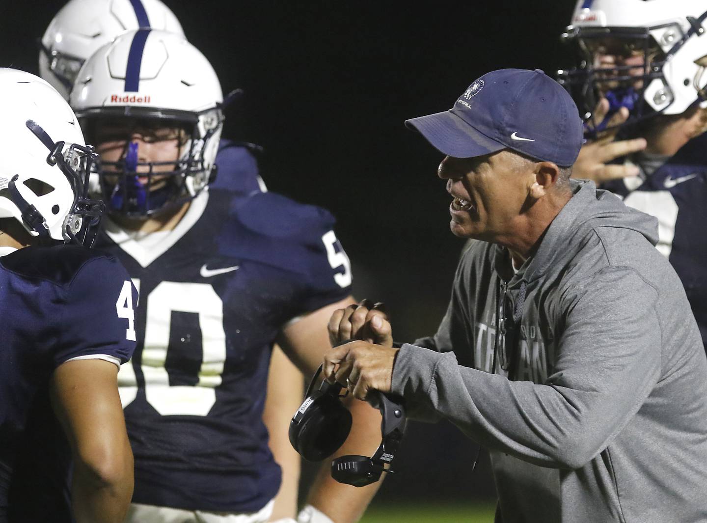 Cary-Crove Head Coach Brad Seaburg stress a point to his team during a Fox Valley Conference football game against Cary-Grove on Friday, Aug. 29, 2025, at Cary-Grove High School in Cary.