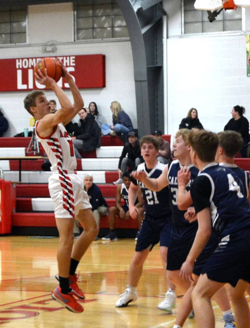 LaMoille's Connor Deering shoots against Calvary Christian on Wednesday in the LaMoille Holiday Classic. The Lions won 50-47.