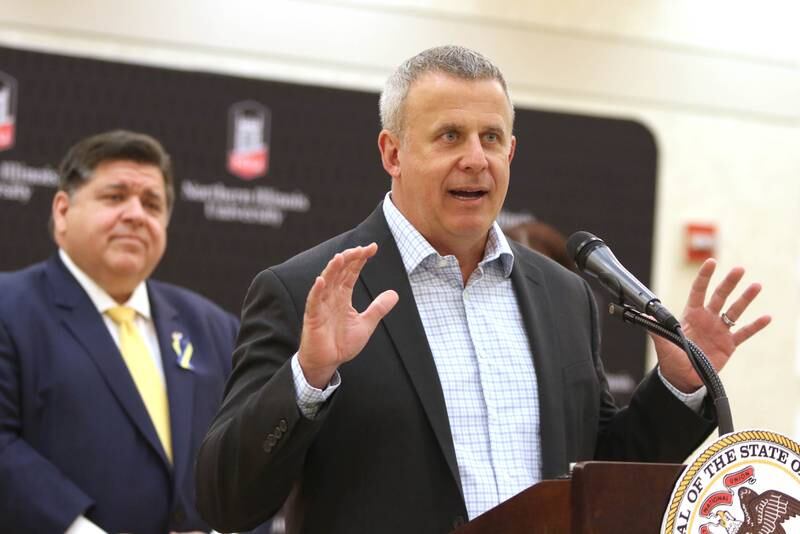 DeKalb Mayor Cohen Barnes speaks as Illinois Gov. JB Pritzker looks on Thursday, March 3, 2022, in the Barsema Alumni and Visitors Center at Northern Illinois University in DeKalb. Pritzker was visiting NIU to talk about the importance of higher education and to tout the programs in Illinois that make that education more accessible to all.