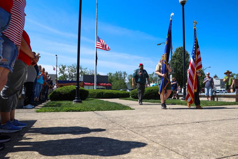 Members of Scout Pack 319 post the colors during the Bradley American Legion's Memorial Day ceremony on Monday, May 25, 2026. Faith Guttendorf, right, and Mieke Hocke carry the flags as troop leader Ryan Barrie accompanies them.