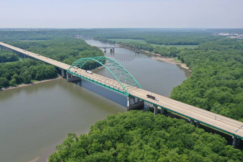 Exposed riverbanks and sandbars can be seen extending into the Illinois River as motorists cross the Abraham Lincoln Memorial Bridge on Interstate 39 on Wednesday, June 7, 2023.  A lack of rainfall this spring has caused the shallow depth of the river.