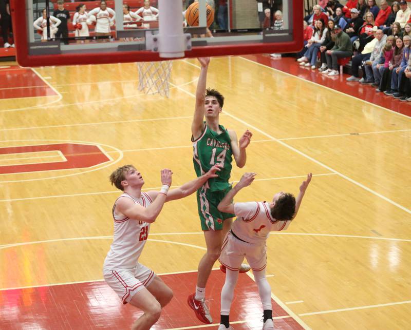 L-P's Wyatt Kilday shoots a jump shot over Ottawa's Owen Sanders and Colt Bryson on Friday, Feb. 6, 2026 in Kingman Gymnasium at Ottawa High School.