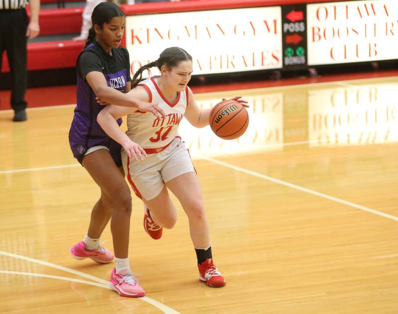 Ottawa's Mary Stisser dribbles around Dixon's Ahmyrie McGowan on Wednesday, Nov. 29, 2023 at Kingman Gym.