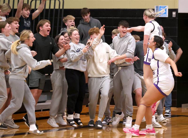 Dixon players and fans celebrate their Class 3A regional championship win over Kaneland Thursday, Feb. 22, 2024, at Sycamore High School.