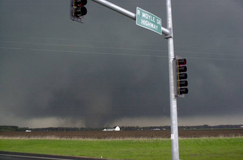 A tornado moves along the Illinios River as it crosses Illinios Route 251 near the intersection of North 25 Road on Tuesday, April 20, 2004 in Oglesby. The tornado was headed straight for the Village of Utica.