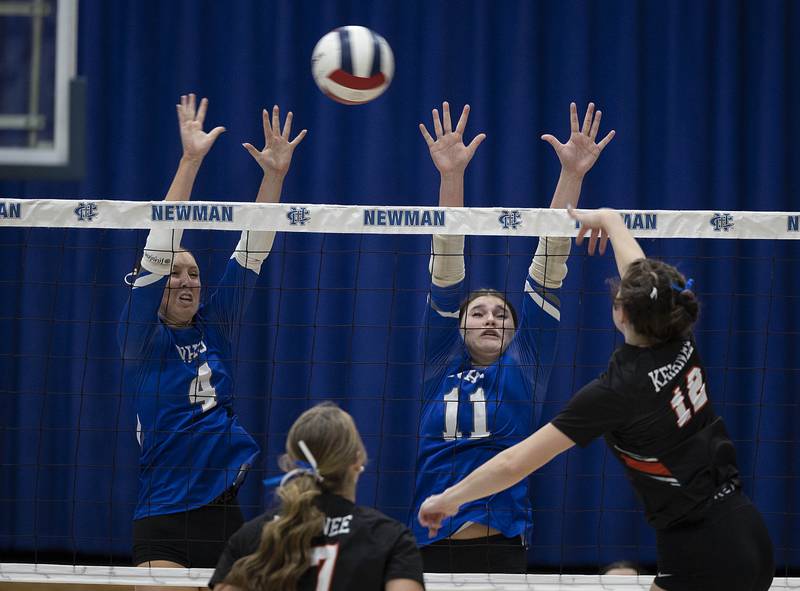 Newman’s Ruby Burger (left) and Isabelle Lanning work to block a shot against Kewanee’s Kolbie Cernovich Tuesday, Sept. 16, 2025.
