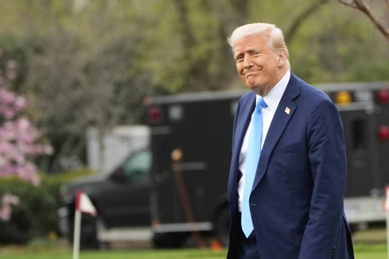 President Donald Trump walks from the Oval Office to board Marine One on the South Lawn of the White House en route to Florida, Friday, March 28, 2025, in Washington. (AP Photo/Mark Schiefelbein)