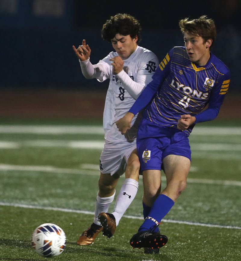Lyons Township's Danny Svelnis kicks the ball away from New Trier's Calyx Hoover during the IHSA Class 3A state championship soccer match on Saturday, Nov. 4, 2023, at Hoffman Estates High School.