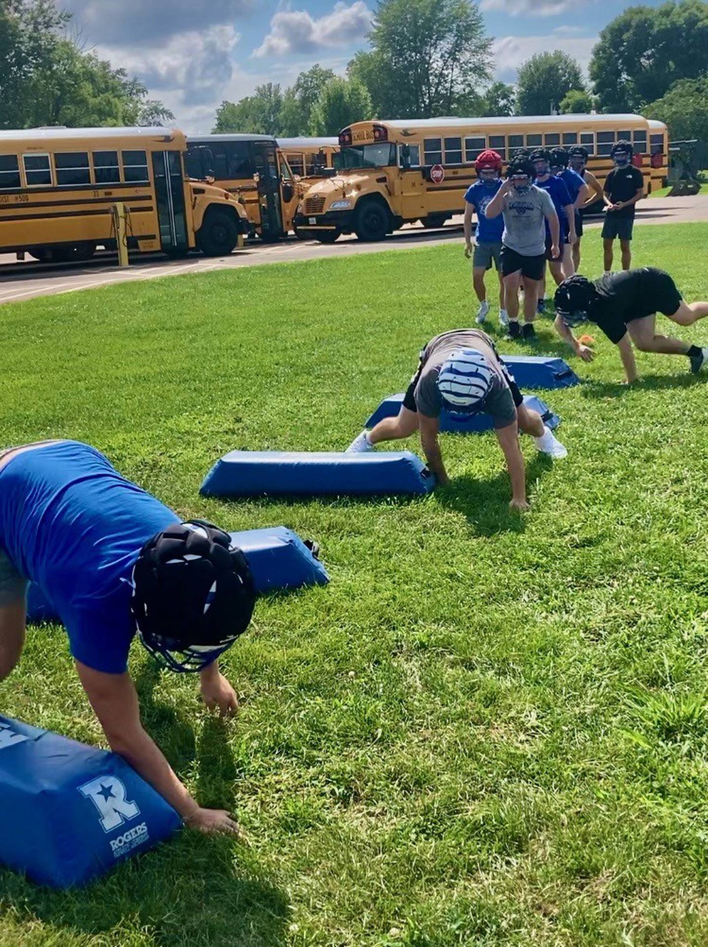 Princeton runs through the "bear crawl" during conditioning drills to start Monday's first fall practice at Little Siberia Field.