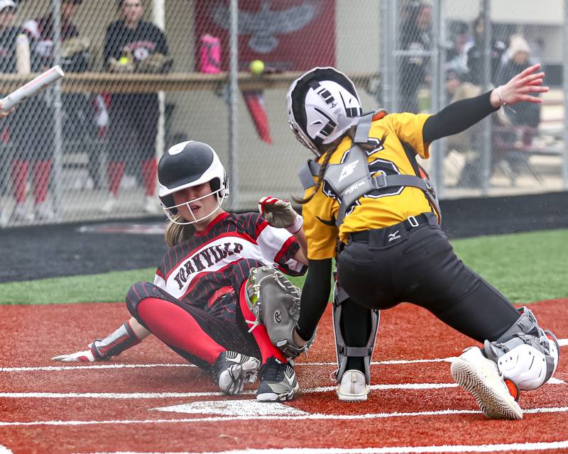 Yorkville's Isla Eidsness (21) slides across the plate where she was called safe during softball game between Joliet West at Yorkville on Wednesday, April 30, 2025 in Yorkville.