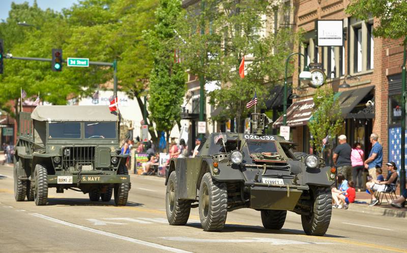 Vintage military vehicles roll down the center of St. Charles during the annual Memorial Day Parade on Monday, May 29, 2023.
