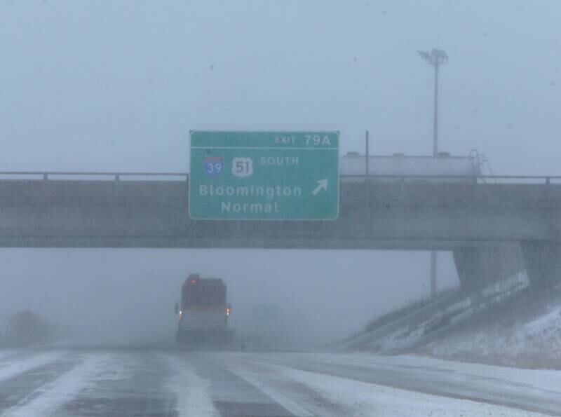 A snowplow pushes snow underneath the overpass of the intersection of Interstates 80 and 39 on Thursday, Feb. 17, 2022.