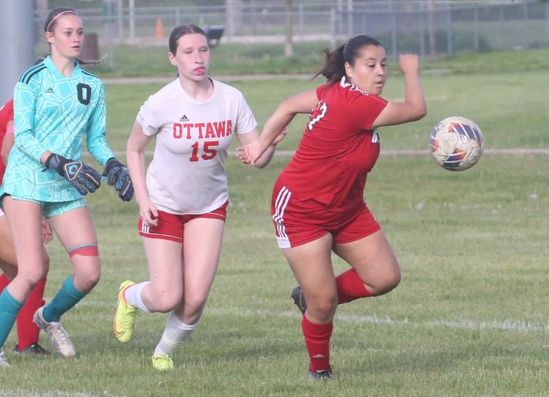 Streator's Abby Calderon chases down the ball in the box as Ottawa's Mary Rodriguez runs behind with keeper Shaelyn Miller during the Class 2A Regional game on Friday, May 10, 2024 at James Street Recreation Complex in Streator.