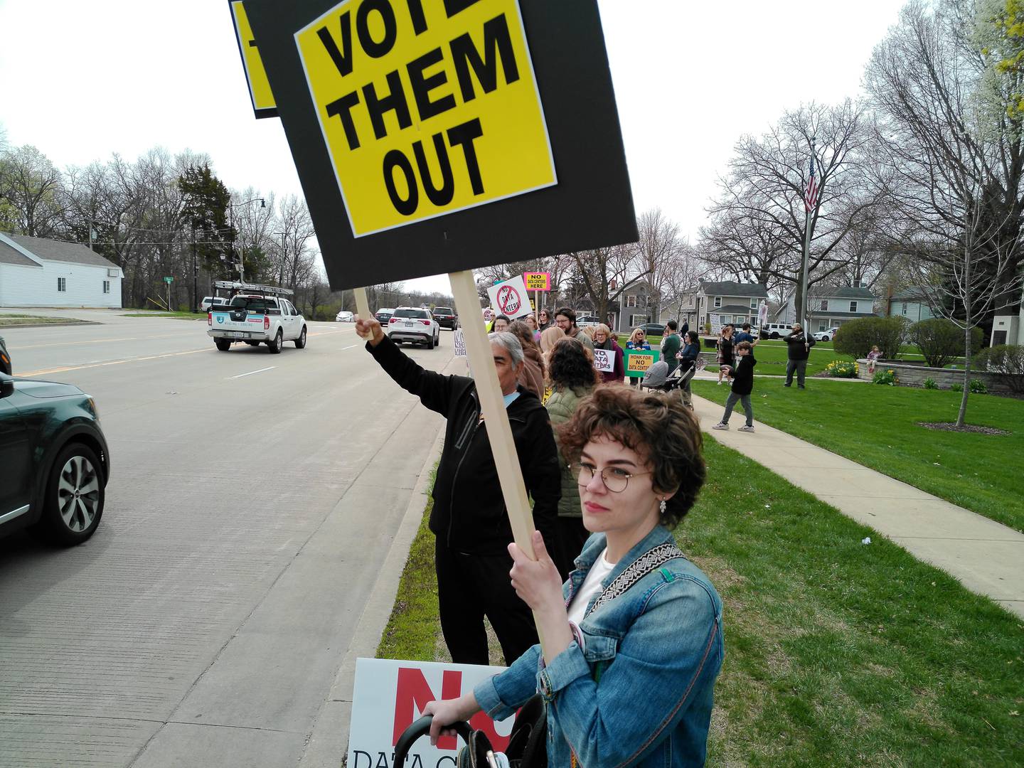 Protesters against data centers lined Illinois Route 47 along Town Square Park in Yorkville on April 11, 2026.