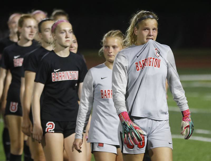 Barrington's Megan Holland leads the team to get their medal after they lost to O'Fallon in overtime in the IHSA Class 3A state championship match at North Central College in Naperville on Saturday, June 3, 2023.