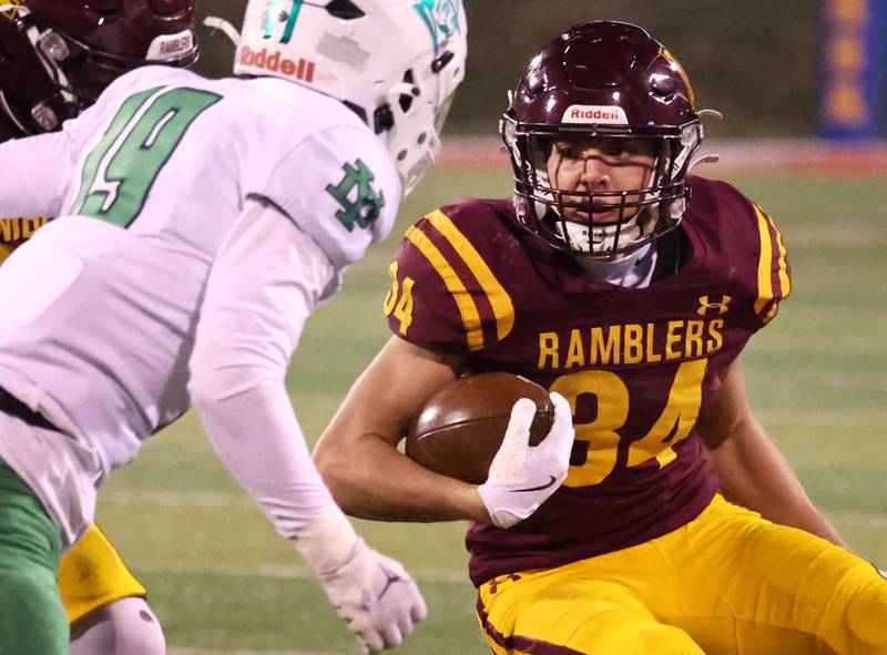 Loyola Academy's Drew MacPherson looks to get by York’s Riggins Kohl during their Class 8A state championship game Saturday, Nov. 30, 2024, in Hancock Stadium at Illinois State University in Normal.