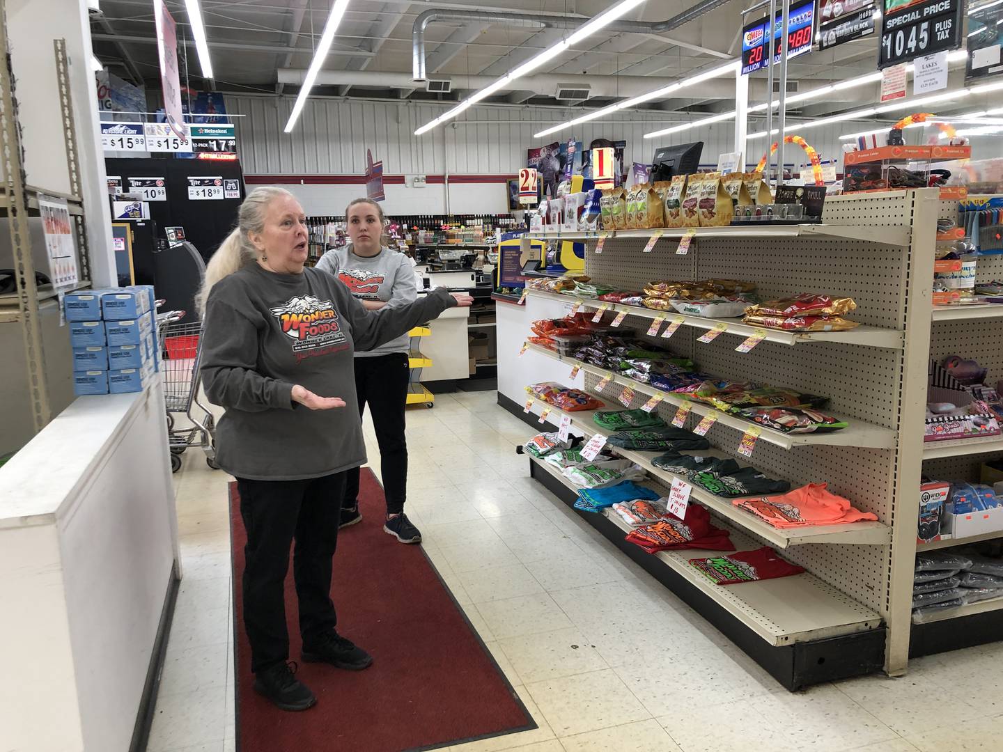 Jeannie Gebbia, left, and Chloe Scott, work at Wonder Foods on Sunday, Oct. 16. The two were told this week their jobs were ending and that the Wonder Lake grocer is closing.