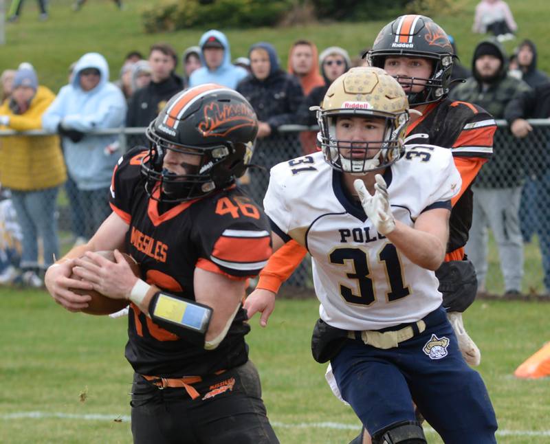 Milledgeville's Spencer Nye (46) intercepts a pass meant for Polo's Noah Dewey (31) during 8-man playoff action on Saturday, Nov. 16, 2024 at Milledgeville.