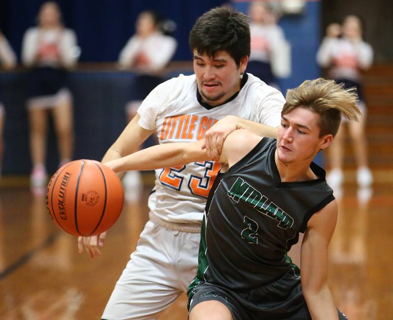 Midland's Riley McFadden (right) is held by DePue's Oscar Lopez (left) as he chases down the basketball on Monday, Dec. 19, 2022 at DePue High School.