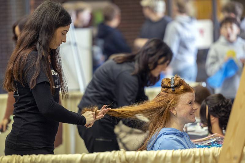 Brittan Mullens of Byron has her hair done by Educators of Beauty student Destiny Carson Friday, Oct. 18, 2024, at Sauk Valley Community College. SVCC played host to the 2024 Pathway Playground, a career exploration experience for  are eighth-graders.