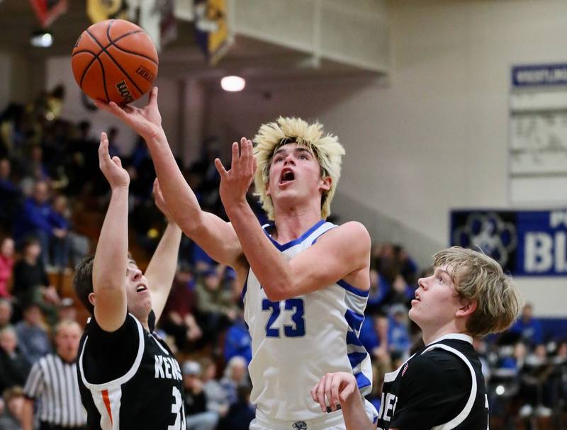 Princeton's Noah LaPorte shoots between Kewanee's Kashen Ellerbrock (left) and Brady Clark Tuesday night at Prouty Gym. The Tigers won 61-55.