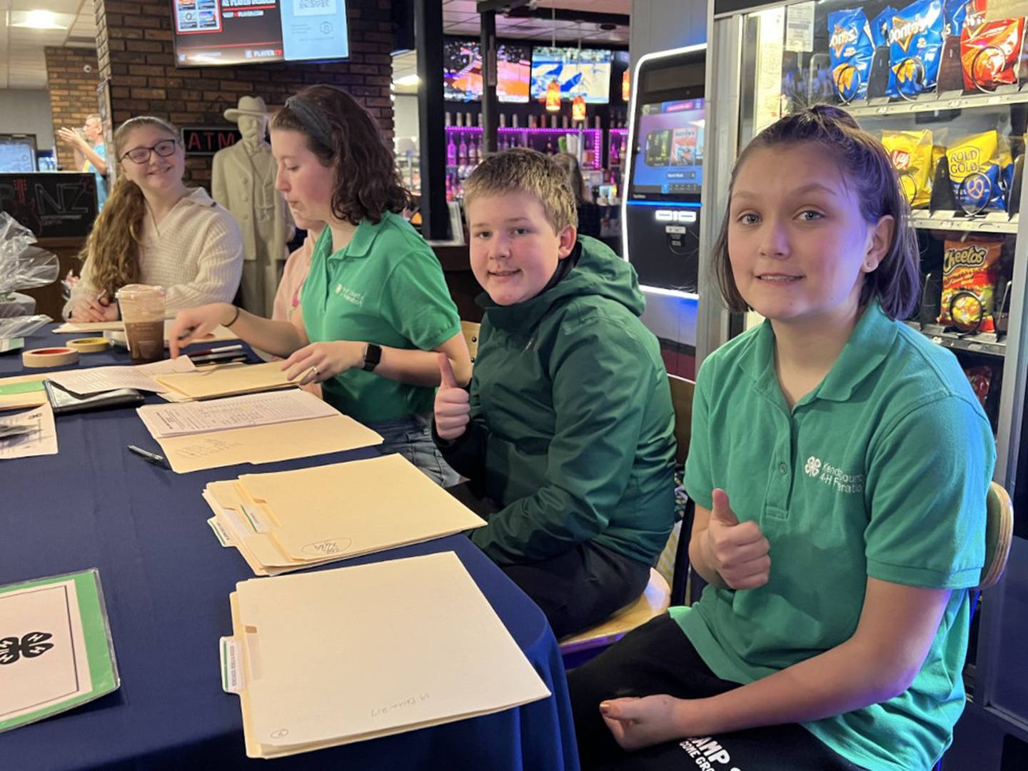 4-H Teen Federation members check in participants for the 2023 Bowl 4 Charity event at PINZ in Yorkville.