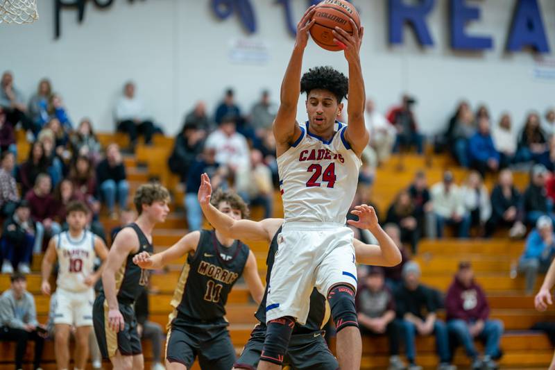 Marmion’s Trevon Roots (24) catches a pass in the post against Morris during the 59th Annual Plano Christmas Classic basketball tournament at Plano High School on Tuesday, Dec 27, 2022.