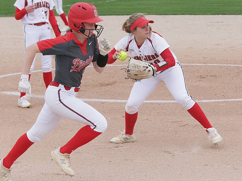 La Salle-Peru's Ava Lannen (10) throws to first base to force out Ottawa's Ryleigh Stehl (10) on a bunt attempt Monday, May 2, 2022, at Veteran's Park in Peru.