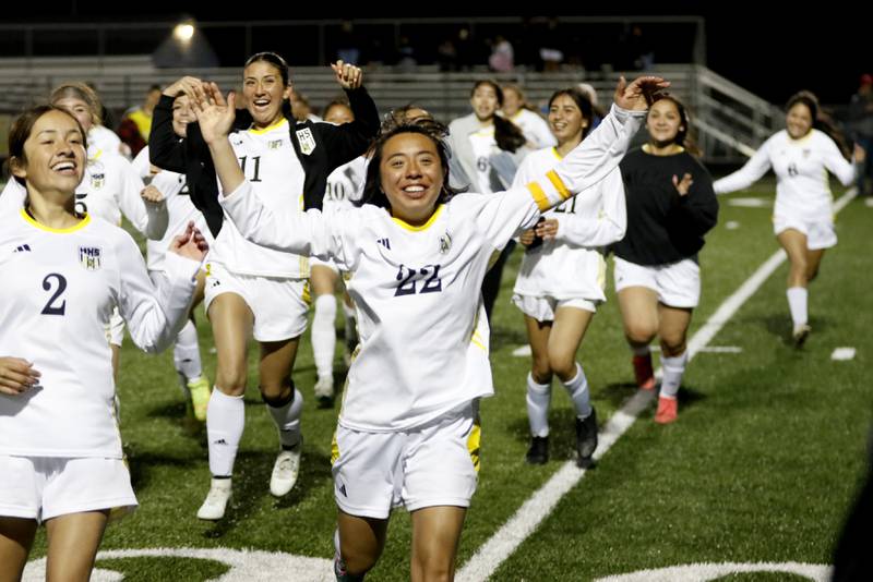 Harvard's Yasmin Paredes and her teammates celebrate Harvard’s 7-6 penalty kick shootout win in the Kishwaukee River Conference Girls Soccer Tournament Championship Match over Richmond-Burton on Wednesday, May 7, 2025, at HRichmond-Burton High School in Richmond.