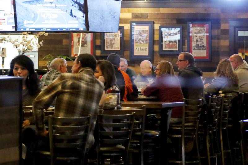 Bar and restaurant patrons pack Oliver's on Friday, Nov. 20, 2020, on Main St. in Woodstock.