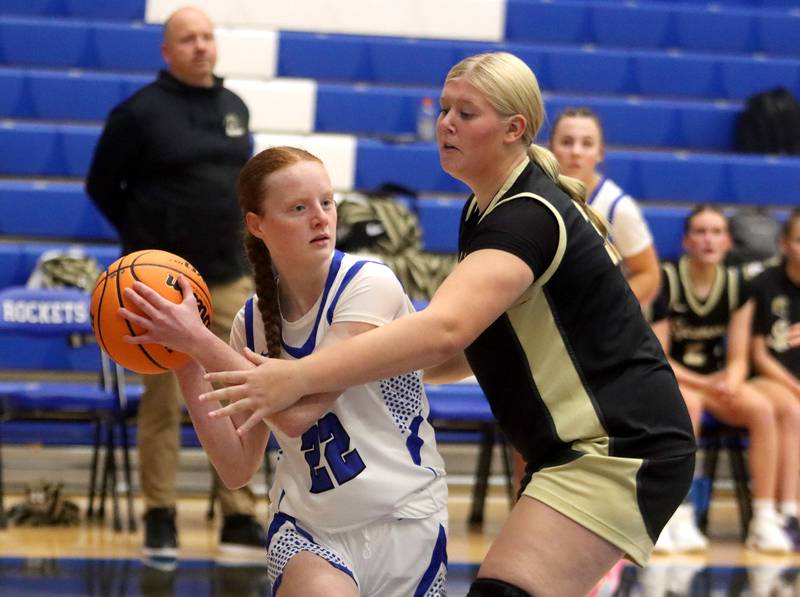 Burlington Central’s Kendall Zierk, left, looks for an option as Sycamore’s Cami Knox defends in girls basketball at Burlington Central High School in Burlington on Tuesday, November 18, 2025.