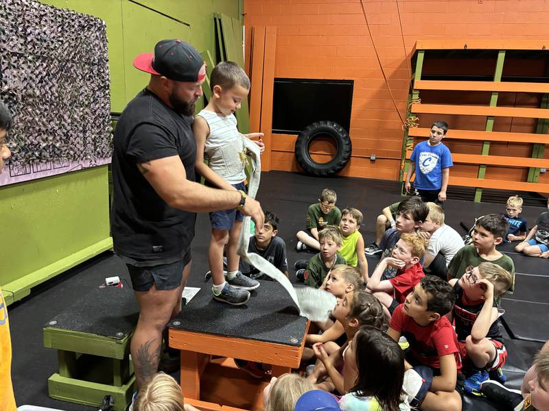 Hot Ground Gym co-owner Sam Simpson teaches first aid at the gym in Libertyville.