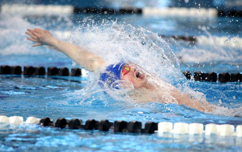St. Charles North’s Thomas McMillan competes in the 100-yard backstroke championship heat during the IHSA Boys State Championships on Saturday, March 1, 2025 at the FMC Natatorium in Westmont.