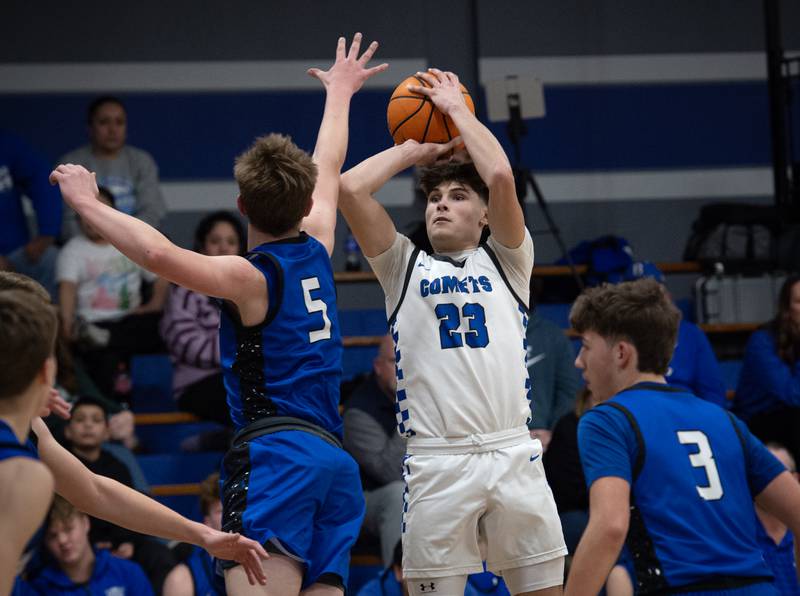 Clifton Central's Mayson Mitchell elevates for a shot as Milford's Isaac Schaumburg guards during a Class A Regional game on Monday, Feb. 23, 2026.