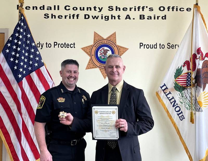 Kendall County Officer John Pacewic (left) was sworn in on Thursday, March 21 by Kendall County Undersheriff Bobby Richardson.