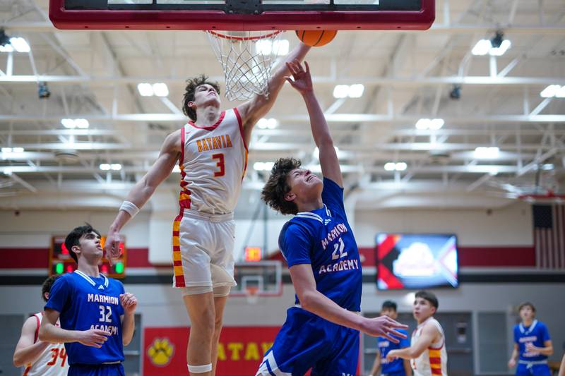 Batavia's Jax Abalos (3) blocks a shot by Marmion’s Colin McEniry (22) during a basketball game at Batavia High School on Wednesday, Nov. 27, 2024.
