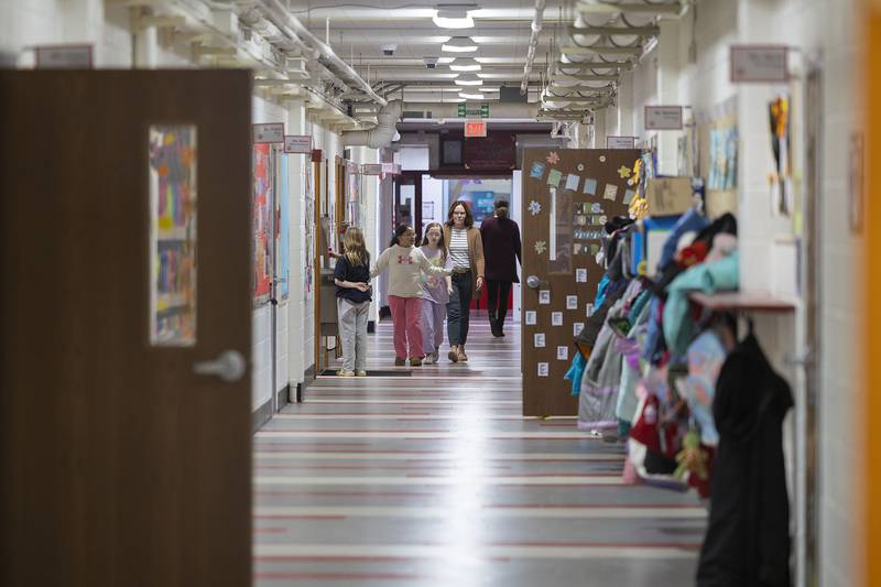 Staff and students move about the hallway Thursday, Nov. 13, 2025, at East Coloma-Nelson School. The school ranked in the top 10% of all Illinois schools in 2025.