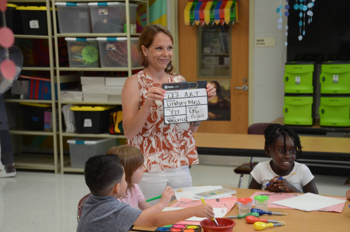 Art teacher Moss holds a clapperboard while filming alongside Yorkville students Colon, Stone and Stephanie Opponga Antwi. (Lucas Robinson - lrobinson@shawmedia.com)