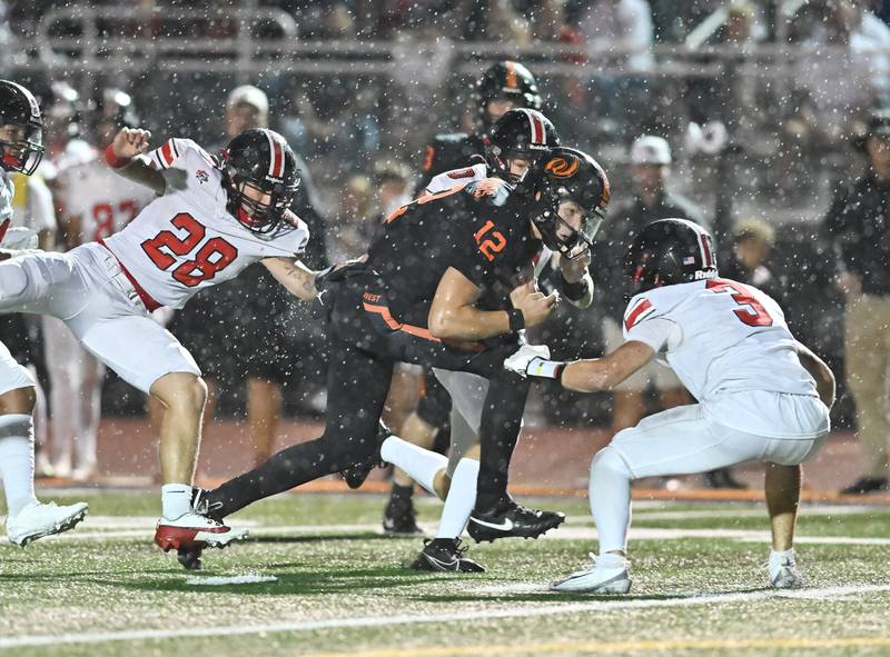 Lincoln-Way West's Grant Tustin (12) rushes for a big gain during the conference game Lincoln-Way Central on Friday, SEP. 19, 2025, at New Lenox.